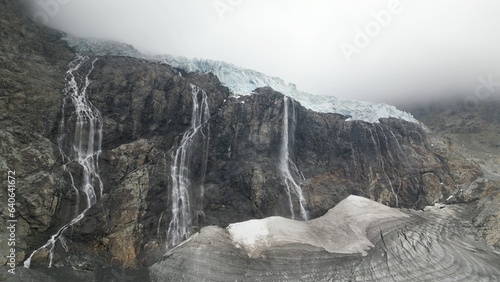Billede på lærred Europe, Italy, Sondrio Valmalenco Alpe Gera-  drone view of Fellaria glacier in Alps -  rapid melting of ice iceberg causes sea level rise