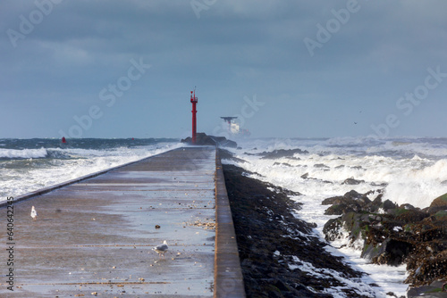 Stormy weather at the pier of Hoek van Holland, a seaside and port town along the Dutch coast near Rotterdam; Hoek van Holland, Netherlands