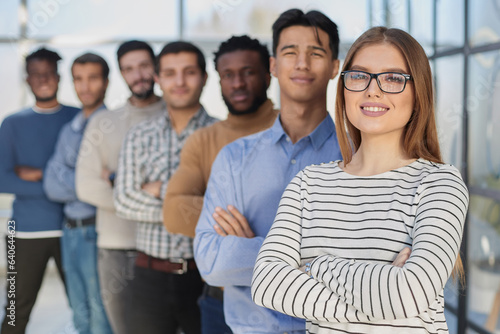 Portrait of multicultural office staff standing in the lobby in a row