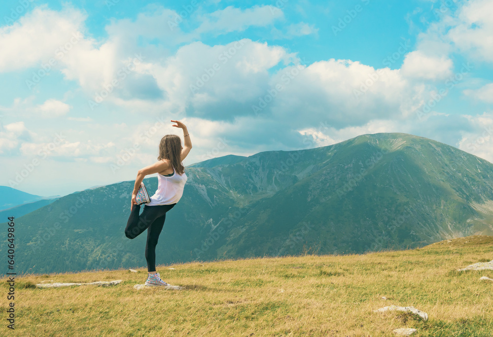 Meditation and gymnastics in a beautiful mountain landscape, at high altitude. A beautiful woman practices Yoga exercises. Meditation and gymnastics in a beautiful mountain landscape, at high altitude. A beautiful woman practices Yoga exercises.