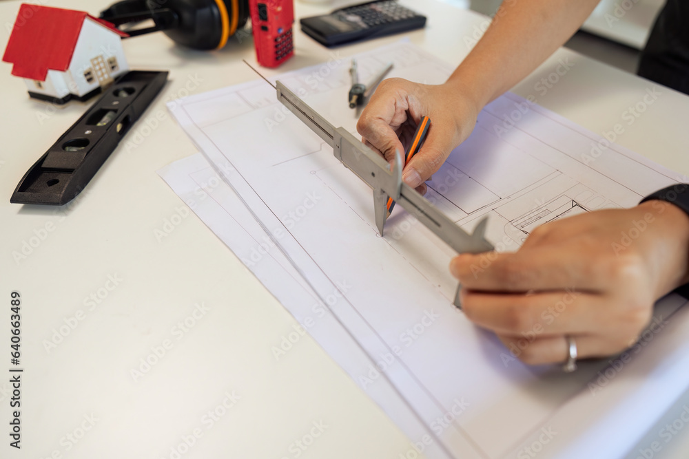 architect working with blueprints, engineer inspection in workplace for architectural plan, sketching a construction project architect working with blueprints, engineer inspection in workplace for architectural plan, sketching a construction project