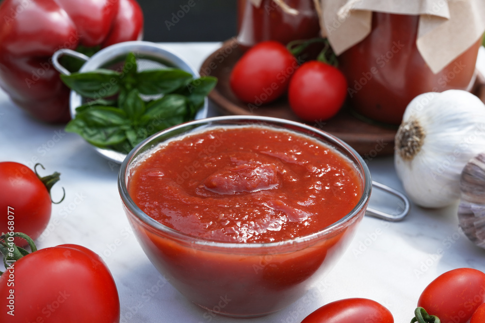 Italian tomato sauce with basil, onion, pepper and garlic. Close-up. Side view. Italian tomato sauce with basil, onion, pepper and garlic. Close-up. Side view.