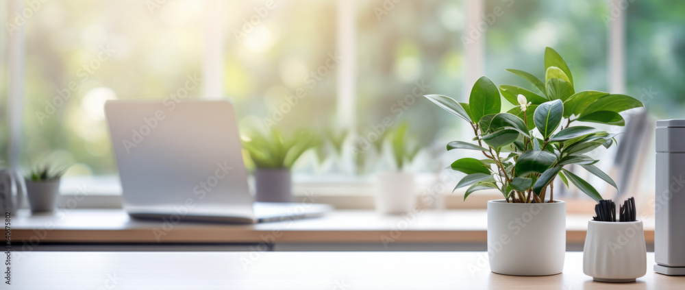 A modern white workspace with copy space against a blurred modern white office as a background A modern white workspace with copy space against a blurred modern white office as a background