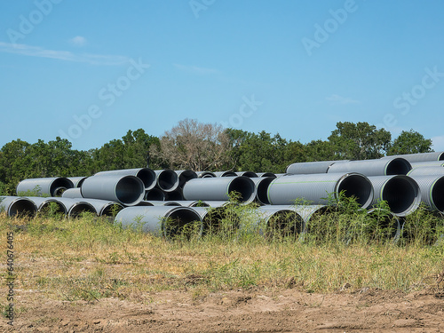 Uniform lengths of large pipes for an underground system for sewage, stormwater drainage, or both in a new residential development in southwest Florida