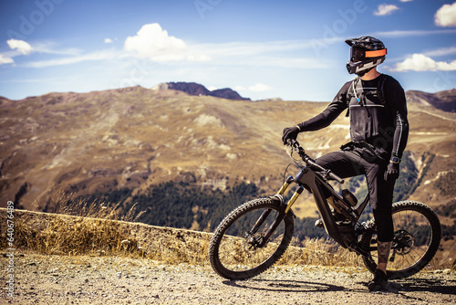 Professional mtb biker. Cycling in the mountains. Alps. Electric bike.