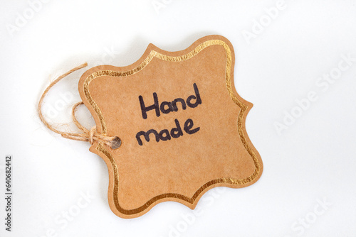 Handmade handwritten on cardboard gift tag, isolated on white