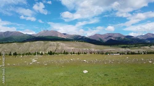 View from the car window to the mountains, Tunkinskaya valley, Siberia. Gimbal shot. photo