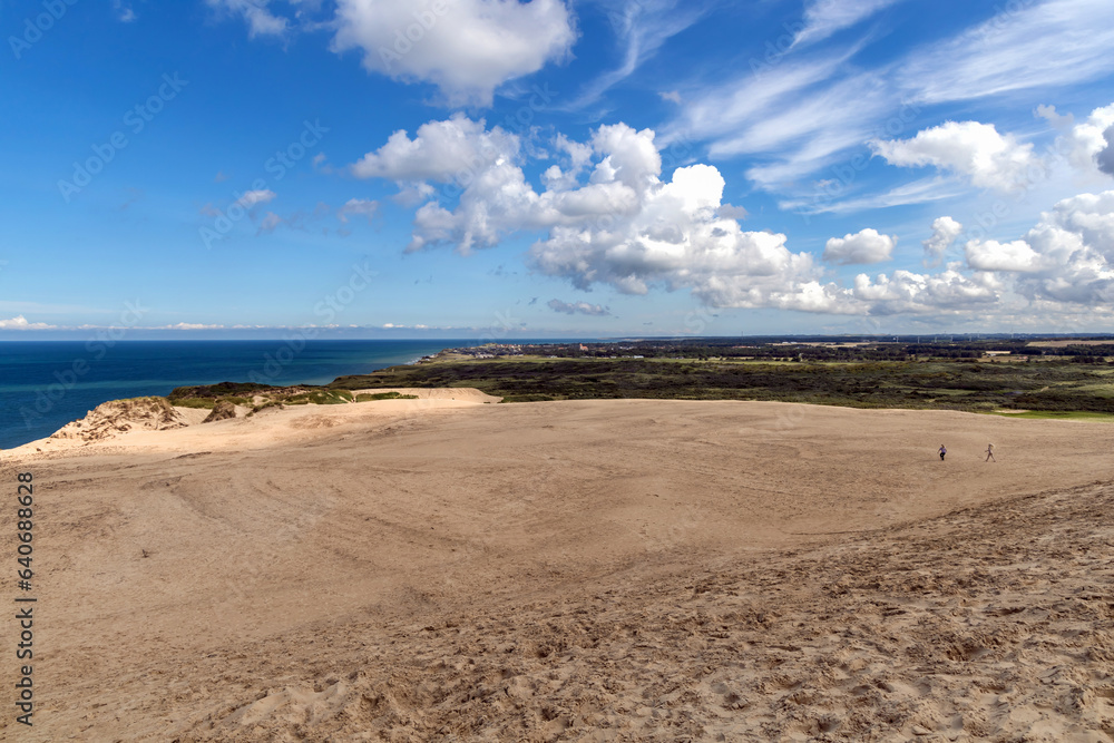 Fototapeta premium Sand dunes and seascape next to Rubjerg Knude Lighthouse.