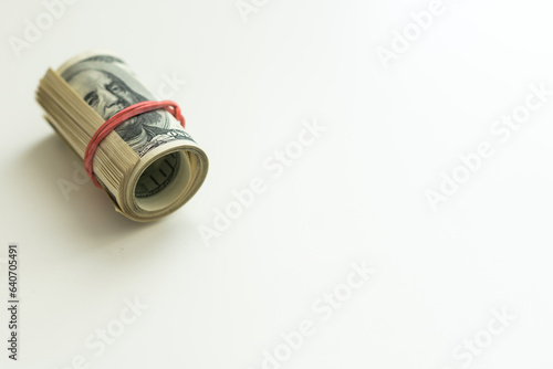 oll of dollars bills isolated on a white background photo