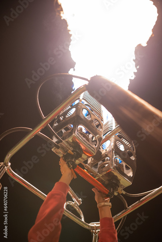 close up of hot air balloon show burner flame glowing at a night