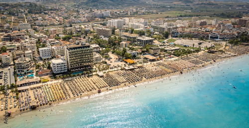  Golem, Durres, Albania - 22 august 2023: Aerial view to sandy beach full of umbrellas and people in summer season 2023