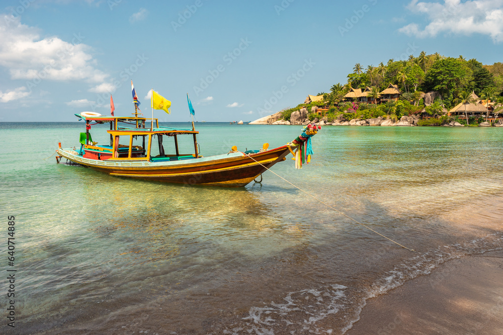 Fototapeta premium Sairee beach on Koh Tao Island in Thailand - tropical exotic paradise scenic sandy sunny beach landscape with local long-tail taxi boat in sea water on shore in the morning