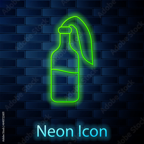 Glowing neon line Cocktail molotov icon isolated on brick wall background. Vector