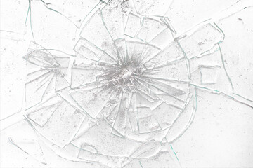 Broken glass on transparent background with lots of glass splinters and cracks