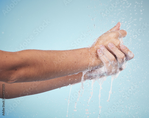 Hands, cleaning and woman with soap and water in studio, blue background and healthcare mockup or skincare. Model, closeup or washing skin for clean, hygiene and protection from bacteria or virus