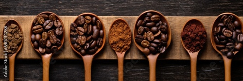 Wooden spoons with coffee beans - different sort ground and whole. Top view on wooden background.