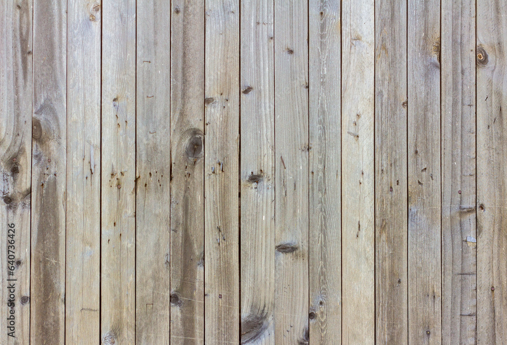 Natural wooden background.An old wooden wall darkened with age. Natural wooden background.An old wooden wall darkened with age.