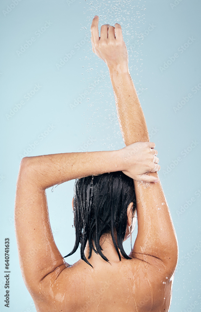 Obraz premium Shower, studio and woman cleaning back, hair or body for wellness on mock up space on blue background. Fresh, water or wet person washing and grooming for healthy natural hygiene or skincare to relax