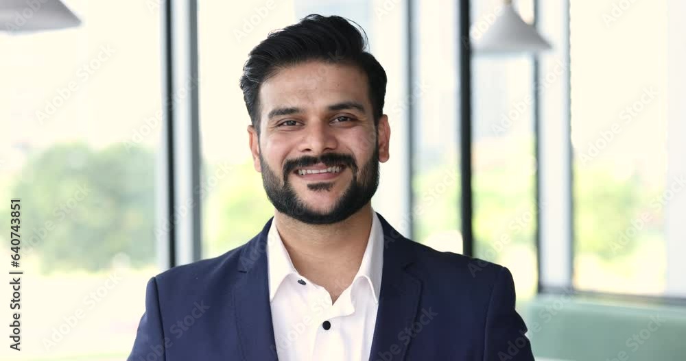 Confident smiling Indian businessman wear formal suit look at camera. Happy proud professional CEO, leader, male company owner posing in modern office, head shot. Successful business person portrait Confident smiling Indian businessman wear formal suit look at camera. Happy proud professional CEO, leader, male company owner posing in modern office, head shot. Successful business person portrait