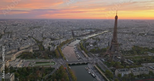 Beautiful view of famous Eiffel Tower in France with colorful twilight romantic sky. Wide establishing aerial morning sunrise or sunset of paris city center best travel destinations landmark in Europe