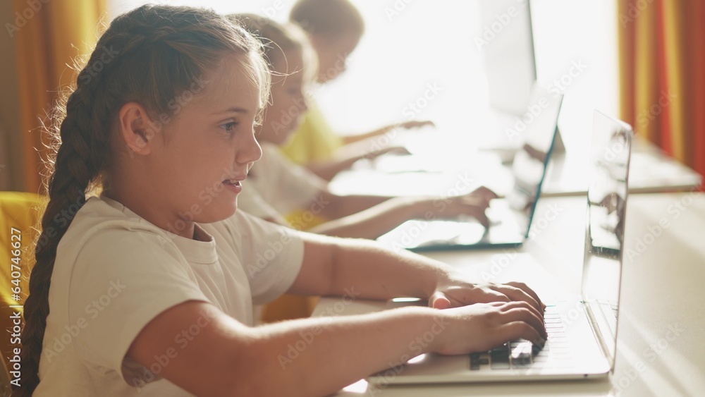 children learn from home through computers. business concept of modern training lifestyle and development. a group of little kids perform tasks in a laptop at home schooling. educating from home children learn from home through computers. business concept of modern training lifestyle and development. a group of little kids perform tasks in a laptop at home schooling. educating from home