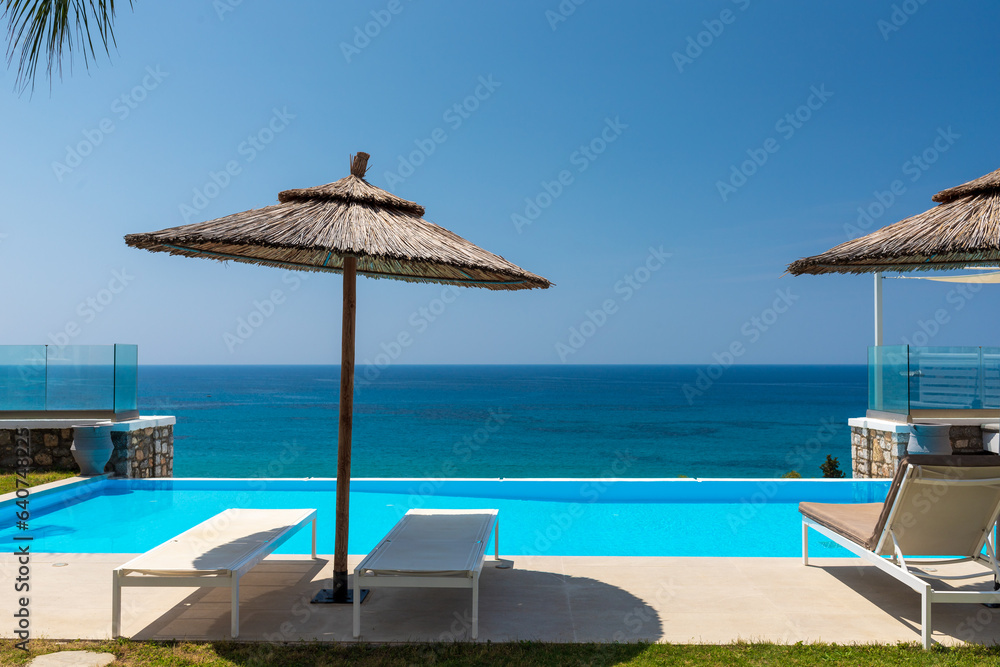 Luxury villa with infinity pool over the sea.