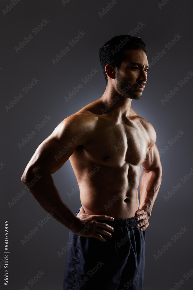Fototapeta premium Muscle, dark studio and man with training challenge, workout and fitness determination, motivation or strength commitment. Body builder progress, thinking athlete and sports person on grey background