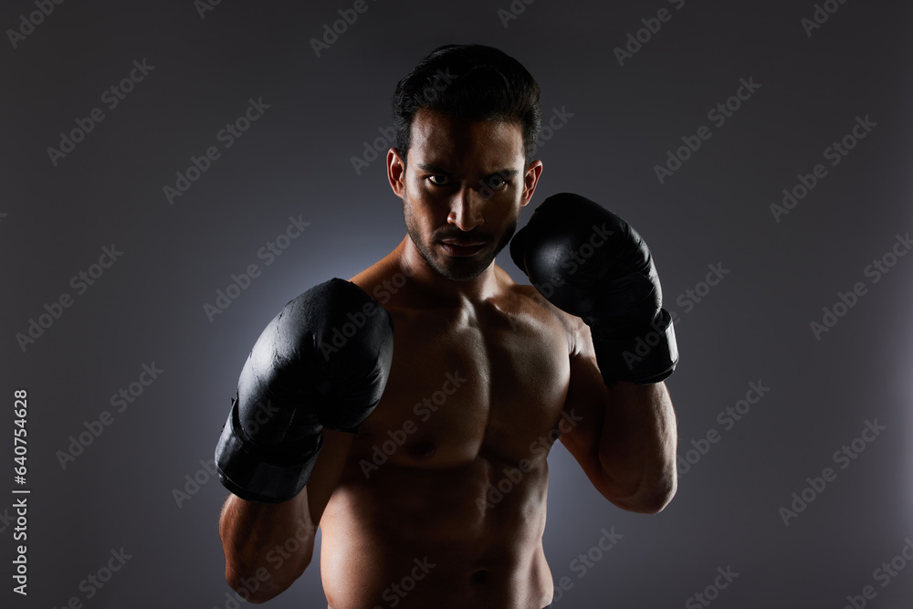 Boxing, studio portrait and sports man with fitness challenge motivation, gym club commitment and fight power workout. Dark shadow, boxer training exercise and strong MMA athlete on grey background