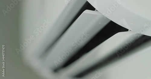 Air conditioner operation, flow louvers move up and down, distributing the air flow