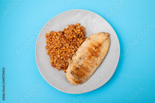 Bowl of boiled red lentils and chicken breast in a ceramic bowl