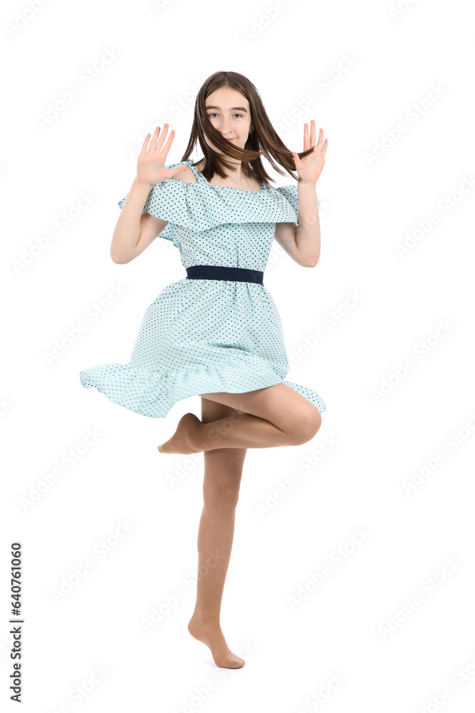 Young beautiful girl in a dress with polka dots on a white background. Young beautiful girl in a dress with polka dots on a white background.