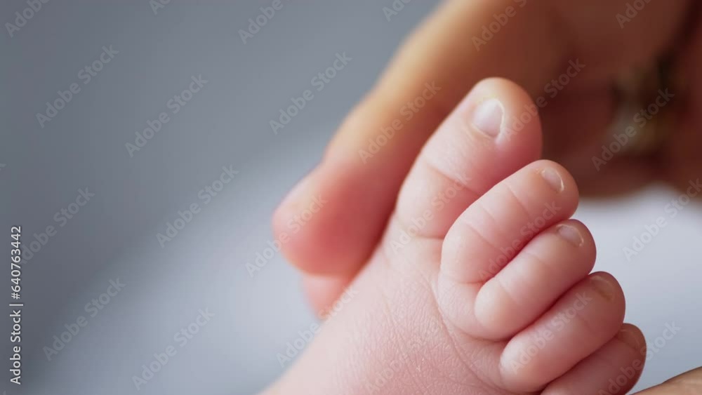 Macro shot of infants toe. Mother touching her small child's toes while he is asleep. Slow motion Video of mother touching her son’s feet. Macro shot of infants toe. Mother touching her small child's toes while he is asleep. Slow motion Video of mother touching her son’s feet.
