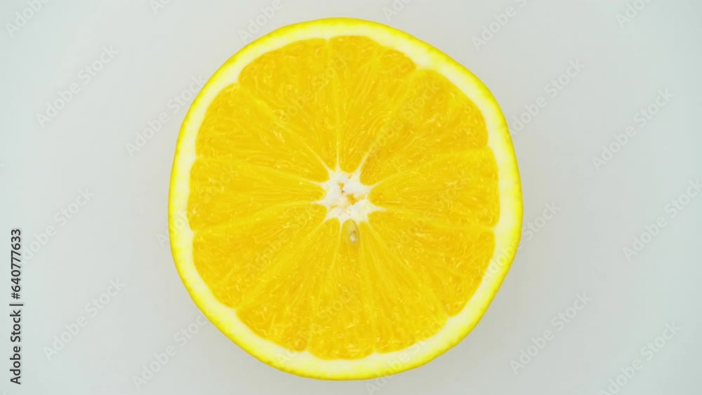 Close-up of an orange spinning in a circle. Free space for insertion. Close-up of an orange spinning in a circle. Free space for insertion.