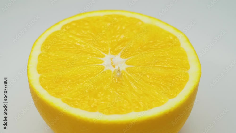 Close-up of an orange spinning in a circle. Free space for insertion. Close-up of an orange spinning in a circle. Free space for insertion.