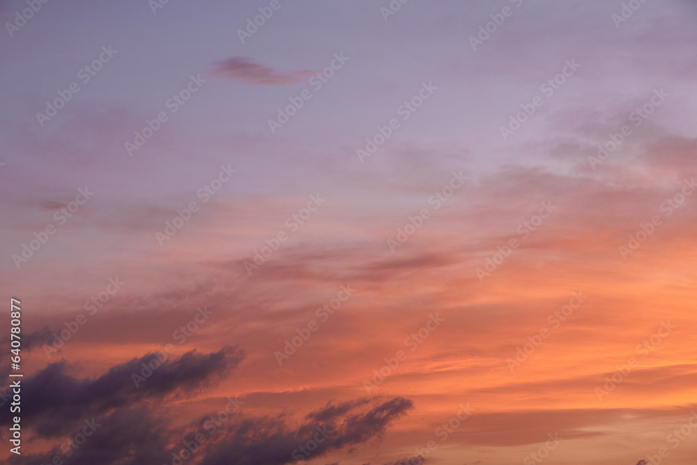 Obraz premium Sky light after sunset. orange background, clouds