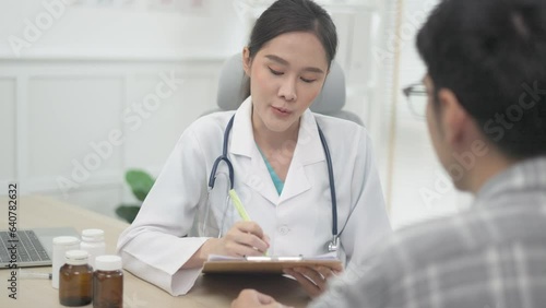 Wallpaper Mural Asian  young Doctor talking to woman patient at the clinic or hospital. Torontodigital.ca