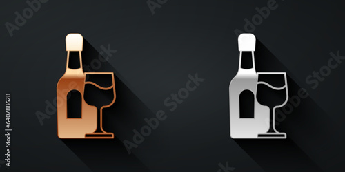Gold and silver Wine bottle with glass icon isolated on black background. Long shadow style. Vector