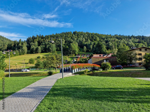 Fototapeta Naklejka Na Ścianę i Meble -  Szczyrk, Poland  August 24, 2023: view of Beskidy Mountains surrounding Szczyrk mountain resort with bridge over Zylica creek in Beskidy Mountains in Silesia. Poland
