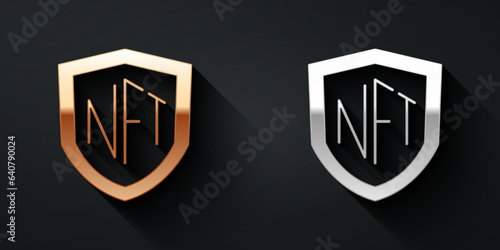 Gold and silver NFT shield icon isolated on black background. Non fungible token. Digital crypto art concept. Long shadow style. Vector