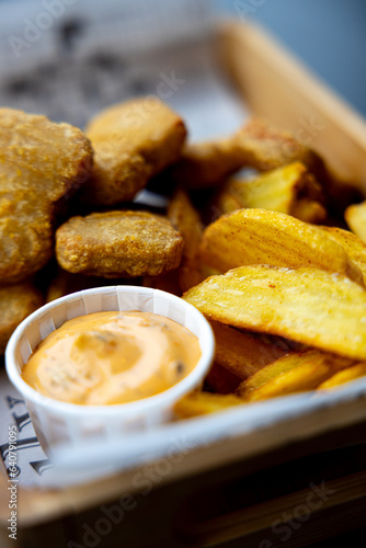 chicken nuggets with fries and sauce