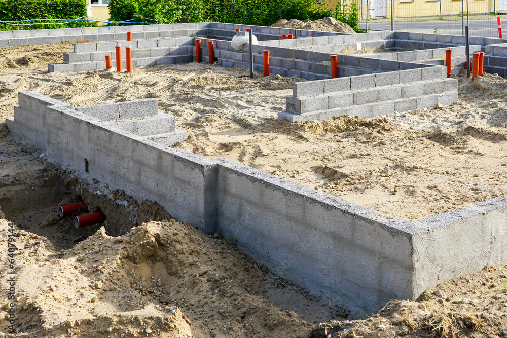 Building the foundation of the house from concrete blocks and installation of pipework system Building the foundation of the house from concrete blocks and installation of pipework system