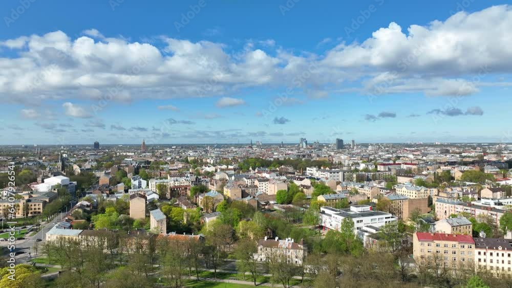 Riga aerial top view famous Riga's Historic city Latvia in panoramatic spring season panorama sunrise blue sky clouds skyscrapers. Beautiful modern historical buildings monuments architecture houses Riga aerial top view famous Riga's Historic city Latvia in panoramatic spring season panorama sunrise blue sky clouds skyscrapers. Beautiful modern historical buildings monuments architecture houses