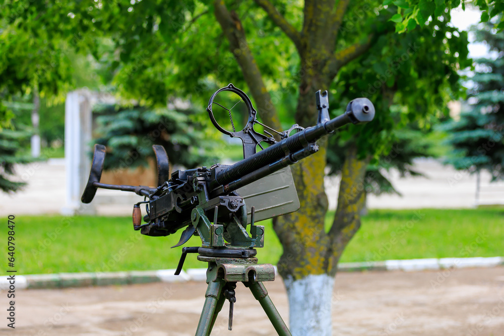 Military gun. Background with selective focus and copy space