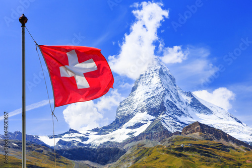 Zermatt, Switzerland. Swiss flag with Matterhorn mountain in the background. Valais region.