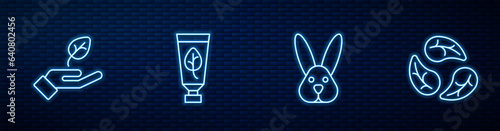 Set line Animal cruelty free, Plant in hand, Organic cosmetic and Leaf or leaves. Glowing neon icon on brick wall. Vector