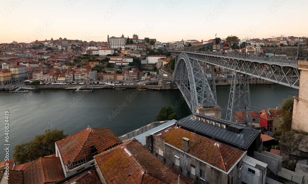 Cityscape of porto Portugal. Ponte de dom luis bridge at sunset. Douro river