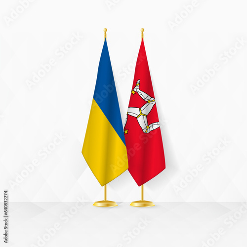 Ukraine and Isle of Man flags on flag stand, illustration for diplomacy and other meeting between Ukraine and Isle of Man.