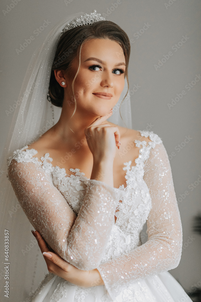 portrait of the bride in her wedding dress in her room. Morning of the bride. Preparation for the wedding ceremony portrait of the bride in her wedding dress in her room. Morning of the bride. Preparation for the wedding ceremony
