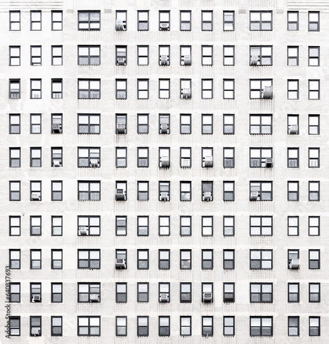 small windows on a white building facade