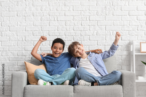 Happy little boys hugging o...